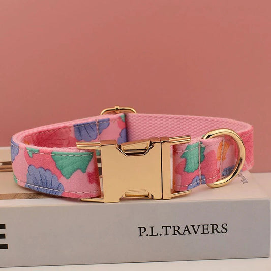 Pink seashell dog leash and bow collar set with cotton fabric and gold hardware.